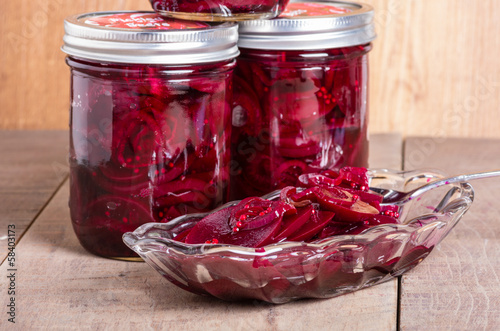 Photo: Pickled beets in jars and bowl Pickled beets in jars and bowl
