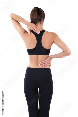 Photo: Back pain in young girls isolated on white Back pain in young girls isolated on white