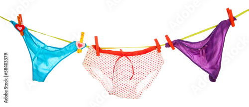 Photo: Women's panties hanging on rope isolated on white Women's panties hanging on rope isolated on white
