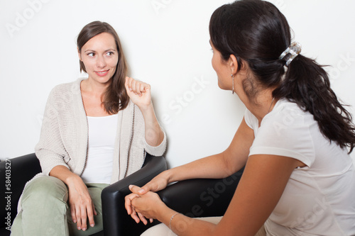 Photo: Two women talking Two women talking
