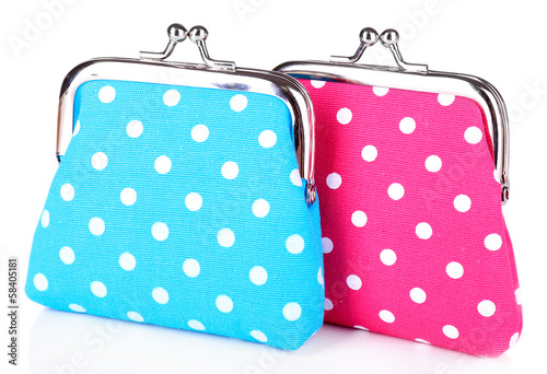 Photo: Blue and pink purses isolated on white Blue and pink purses isolated on white