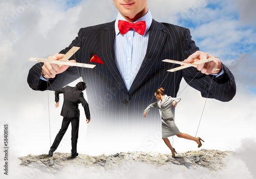 Photo: Businessman puppeteer Businessman puppeteer
