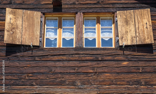Photo: Two windows of a wooden hut Two windows of a wooden hut