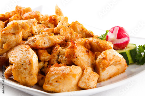 Photo: Grilled meat and vegetables on white background Grilled meat and vegetables on white background