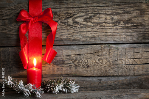 Photo: Christmas abstract background with red ribbon on vintage boards Christmas abstract background with red ribbon on vintage boards