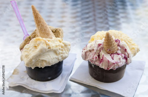 Photo: Two portions of ice cream on the table. Two portions of ice cream on the table.