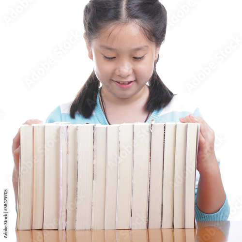 Photo: Student girl doing homework Student girl doing homework
