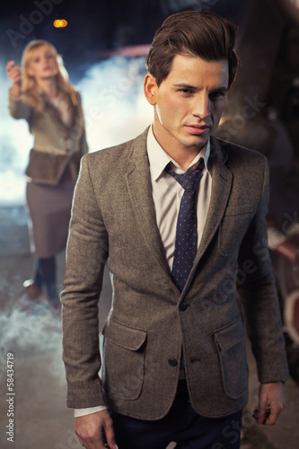 Photo: Handsome man leaving his wife on the platform Handsome man leaving his wife on the platform