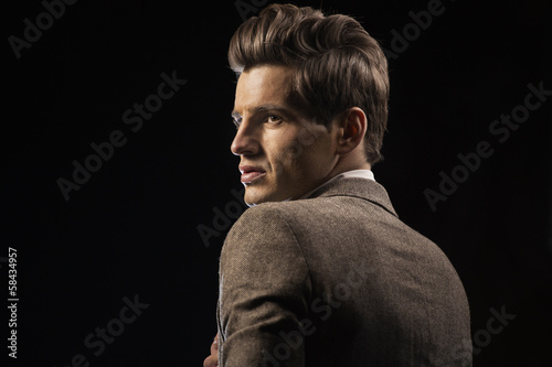 Photo: Attractive guy with the black background Attractive guy with the black background