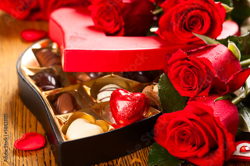 Photo: box of chocolate truffles with red roses box of chocolate truffles with red roses