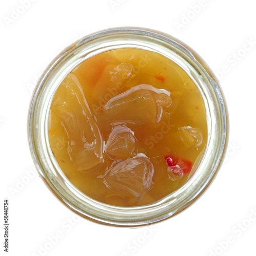 Photo: Green tomato piccalilli in an open jar Green tomato piccalilli in an open jar