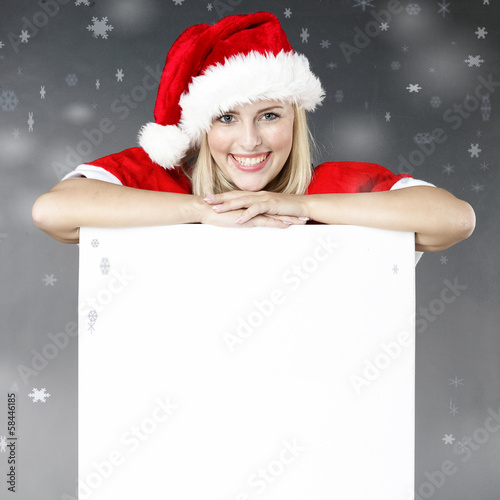 Photo: Woman shows voucher for christmas Woman shows voucher for christmas