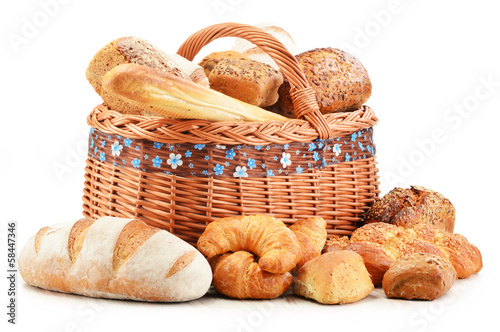Photo: Wicker basket with baking products isolated on white Wicker basket with baking products isolated on white
