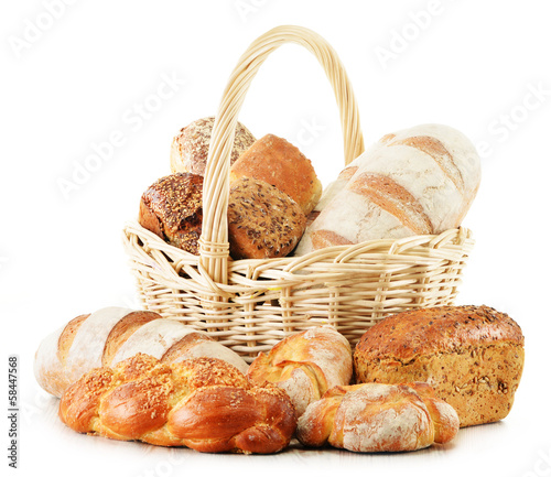 Photo: Wicker basket with baking products isolated on white Wicker basket with baking products isolated on white