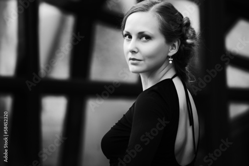 Photo: Beautiful young woman in black dress Beautiful young woman in black dress