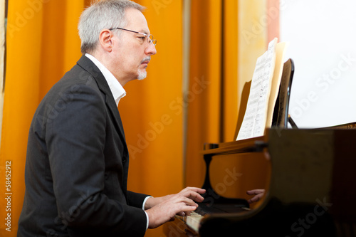 Photo: Pianist playing the piano Pianist playing the piano
