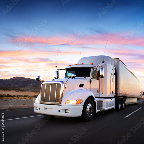  Truck and highway at sunset - transportation background