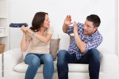 Photo: Woman Hitting Man With Sauce Pan Woman Hitting Man With Sauce Pan