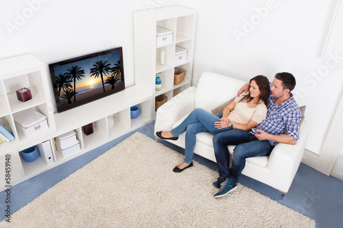 Photo: Couple Watching Television Couple Watching Television