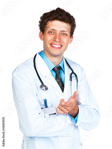 Photo: Full length portrait of the doctor standing on a white Full length portrait of the doctor standing on a white