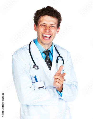 Photo: Portrait of a smiling male doctor showing finger at you on white Portrait of a smiling male doctor showing finger at you on white