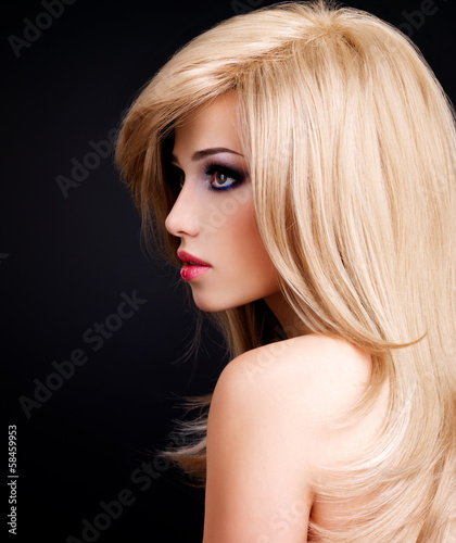 Photo: Portrait of a beautiful young woman with long white hairs Portrait of a beautiful young woman with long white hairs