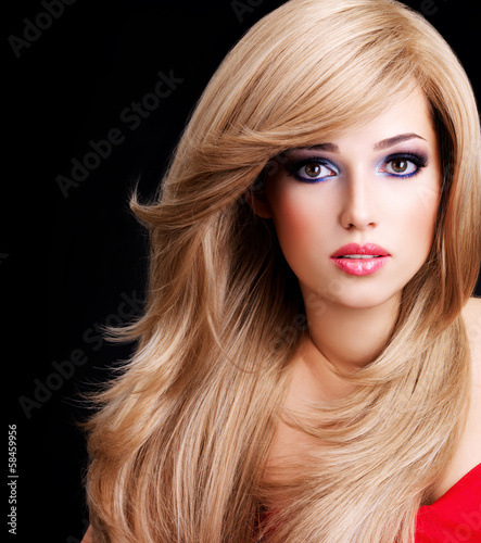 Photo: Portrait of a beautiful young woman with long white hairs Portrait of a beautiful young woman with long white hairs