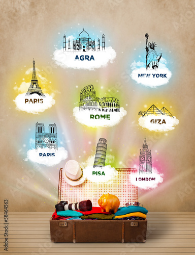 Photo: Tourist suitcase with famous landmarks around the world Tourist suitcase with famous landmarks around the world