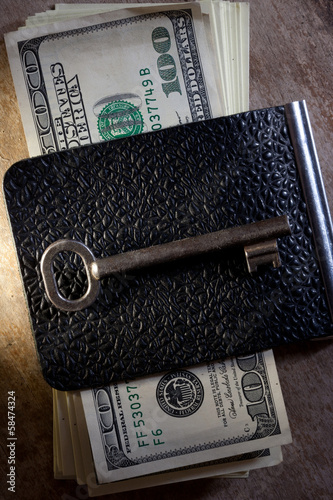 Photo: Key to Financial Success. Money, key. Key to Financial Success. Money, key.