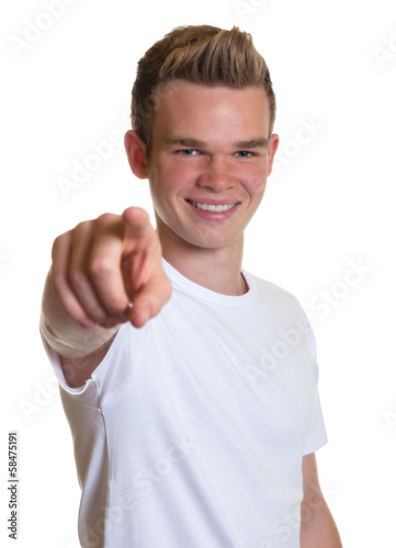 Photo: Guy with blond hair pointing at camera Guy with blond hair pointing at camera