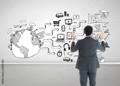 Photo: Composite image of businessman with arms raised Composite image of businessman with arms raised