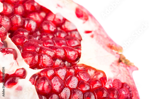 Photo: Pomegranate with its seeds close-up Pomegranate with its seeds close-up