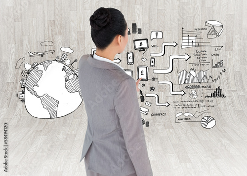 Photo: Composite image of asian businesswoman pointing Composite image of asian businesswoman pointing