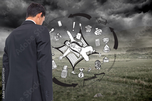 Photo: Composite image of business graphic on stormy background Composite image of business graphic on stormy background