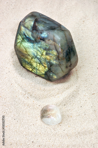 Photo: Two different crystals on sand Two different crystals on sand