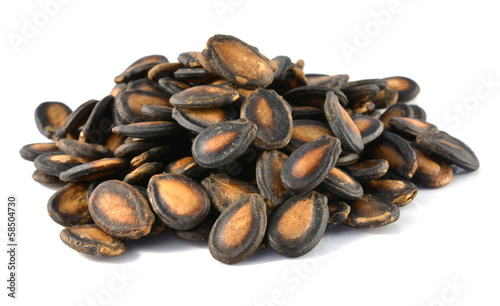 Photo: dry watermelon seed on white background dry watermelon seed on white background