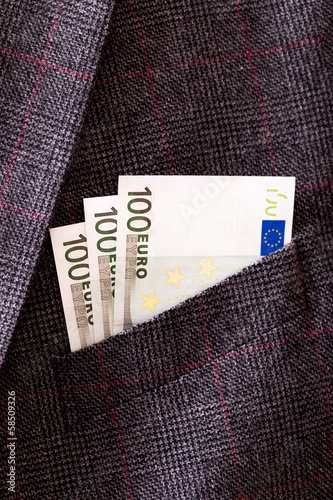 Photo: Euro banknotes in pocket closeup Euro banknotes in pocket closeup