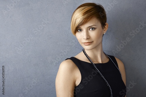 Photo: Beautiful young woman wearing pearl necklace Beautiful young woman wearing pearl necklace