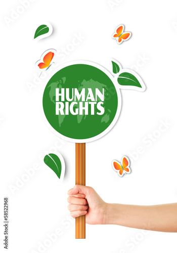 Illustration: Hand holding green world human rights sign Hand holding green world human rights sign