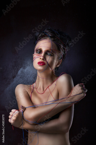Photo: girl in a web of threads. girl in a web of threads.