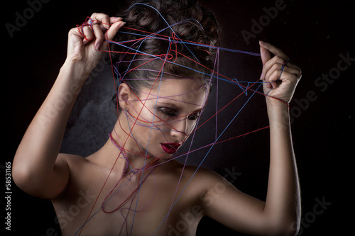 Photo: girl in a web of threads. girl in a web of threads.