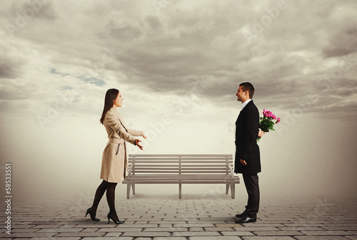 Photo: beautiful woman greeting her man beautiful woman greeting her man