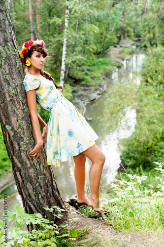 Photo: Attractive woman with flower wreath Attractive woman with flower wreath