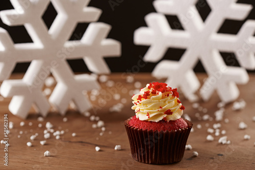 Photo: Red velvet cupcake on Christmas background Red velvet cupcake on Christmas background