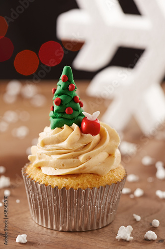 Photo: Xmas tree cupcake on Christmas background Xmas tree cupcake on Christmas background