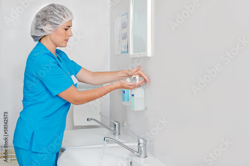 Photo: Beautiful nurse wiped his hands dry Beautiful nurse wiped his hands dry