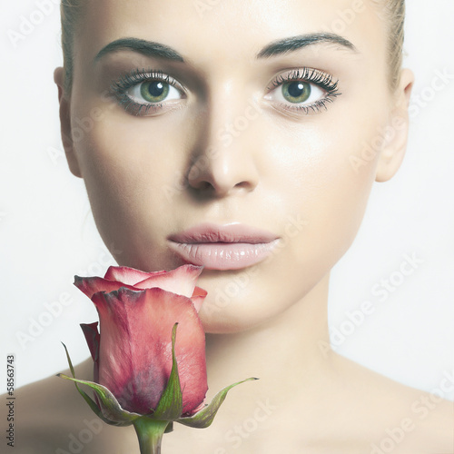 Photo: beautiful blond woman with flower.girl and rose.tender beautiful blond woman with flower.girl and rose.tender