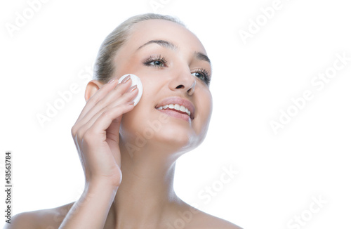 Photo: beauty woman face with cotton pad beauty woman face with cotton pad
