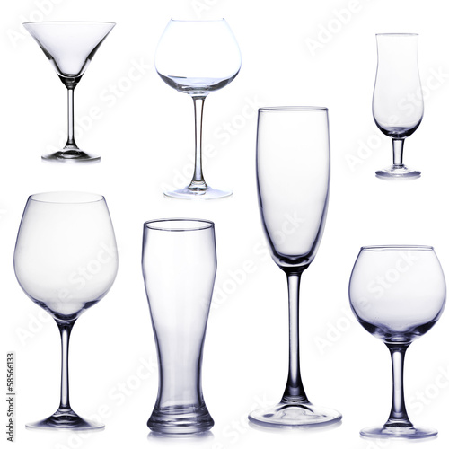 Photo: Collage of empty glasses isolated on white Collage of empty glasses isolated on white
