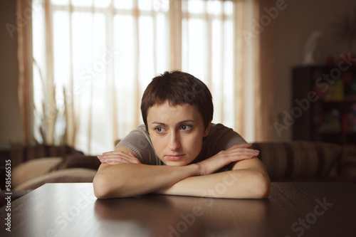 Photo: Beautiful young woman dreaming about something Beautiful young woman dreaming about something